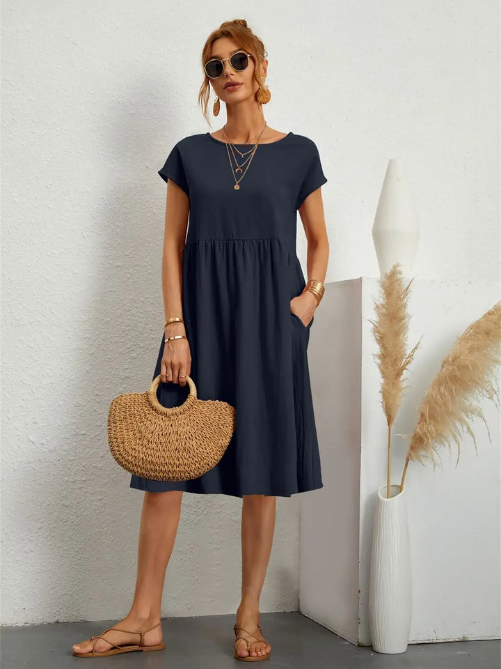 Women's versatile casual midi dress with pockets for ultimate comfort and style.