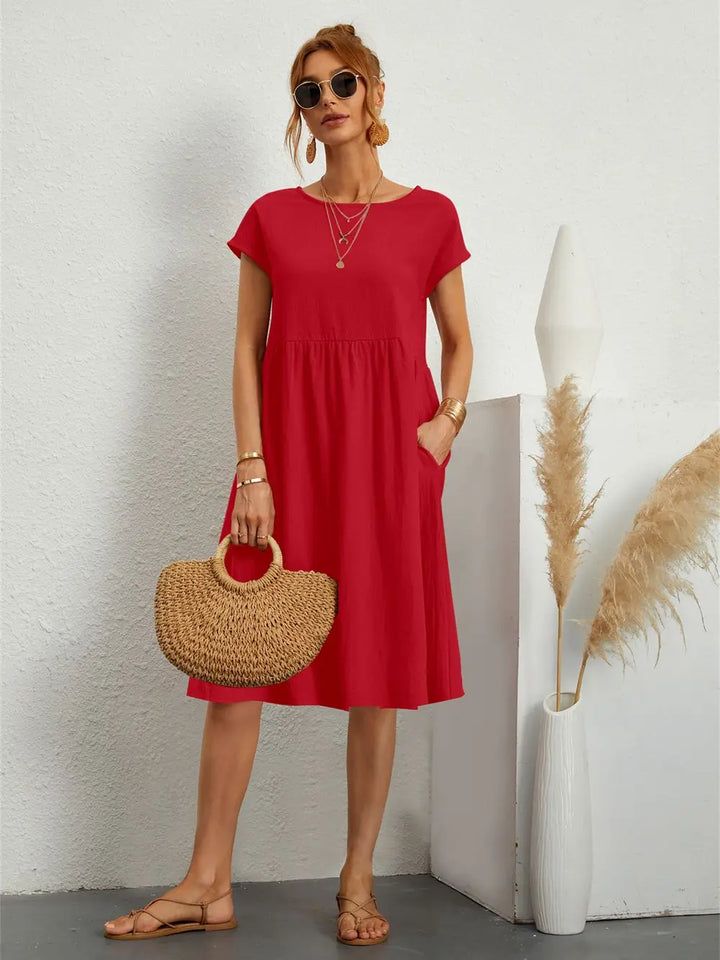 Soft women's casual midi dress with deep pockets for comfortable spring & summer days.