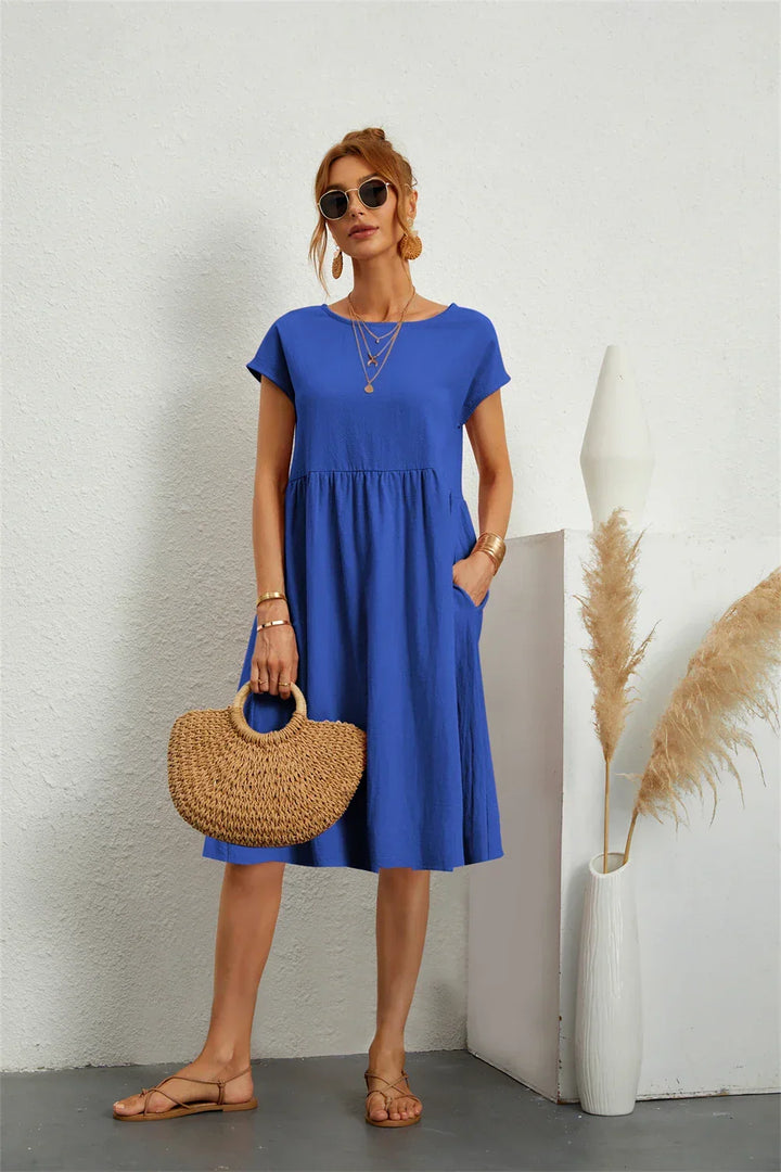 Stylish women's casual midi dress with a comfortable fit and functional pockets.