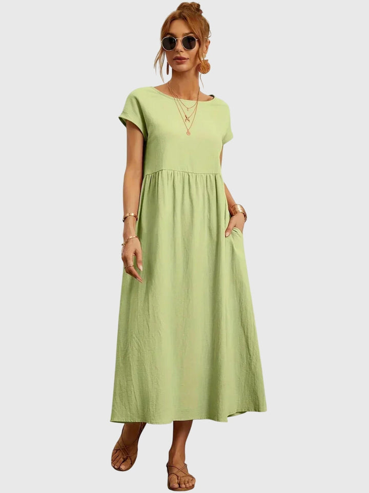 Effortlessly stylish women's casual pocket dress, a relaxed fit solid color midi dress for versatile daily wear.