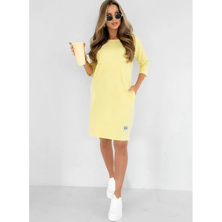 Stylish women's mini dress with 3/4 sleeves and a classic crew neck, ideal for spring & summer casual wear.