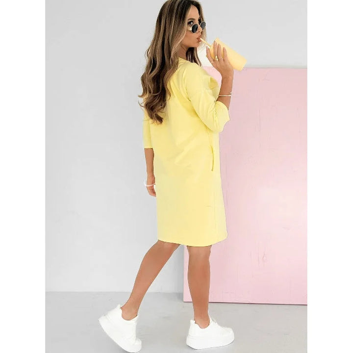 Women's casual mini dress with 3/4-sleeves, crew neck & stripe detail. Comfortable, versatile short dress with pockets.