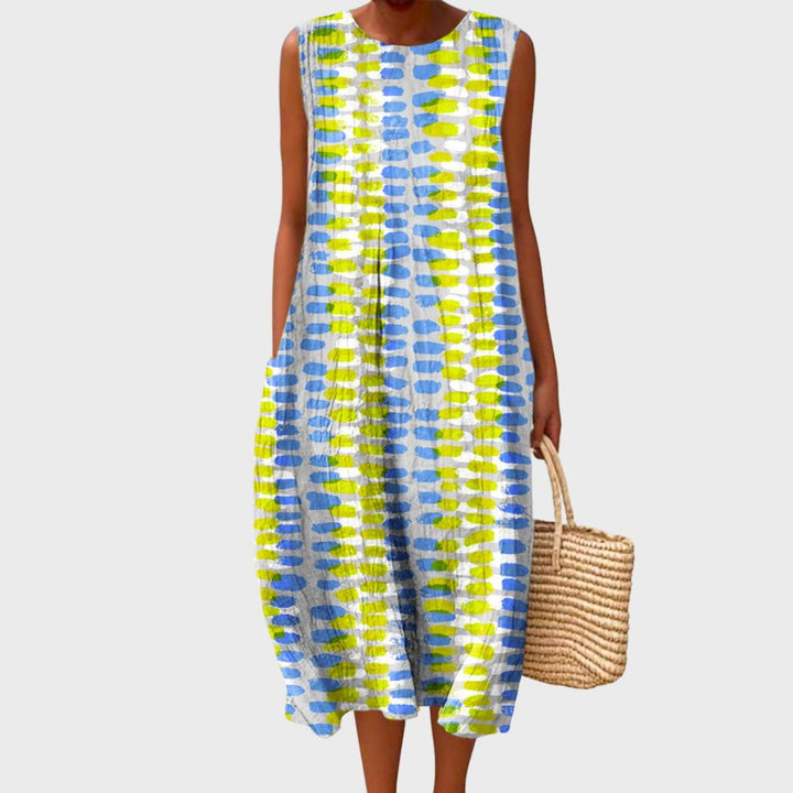 Vibrant plaid sleeveless midi dress for women. A comfortable and stylish tiered summer vacation dress or beachwear.