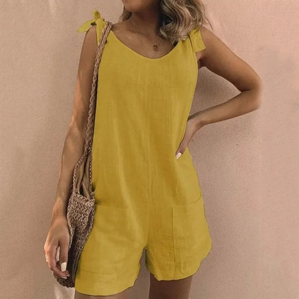 Stylish women's sleeveless short jumpsuit featuring charming bow-tie straps & convenient pockets.