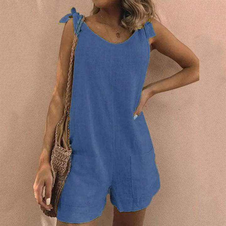 Casual women's short romper, one-piece design with bow-tie straps and functional pockets for comfort.