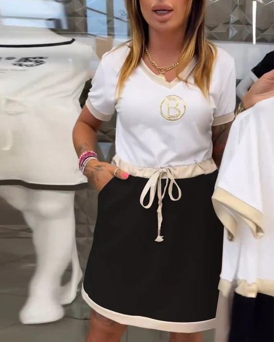 Relaxed fit women's short sleeve dress featuring a stylish contrast trim and adjustable drawstring for summer comfort.