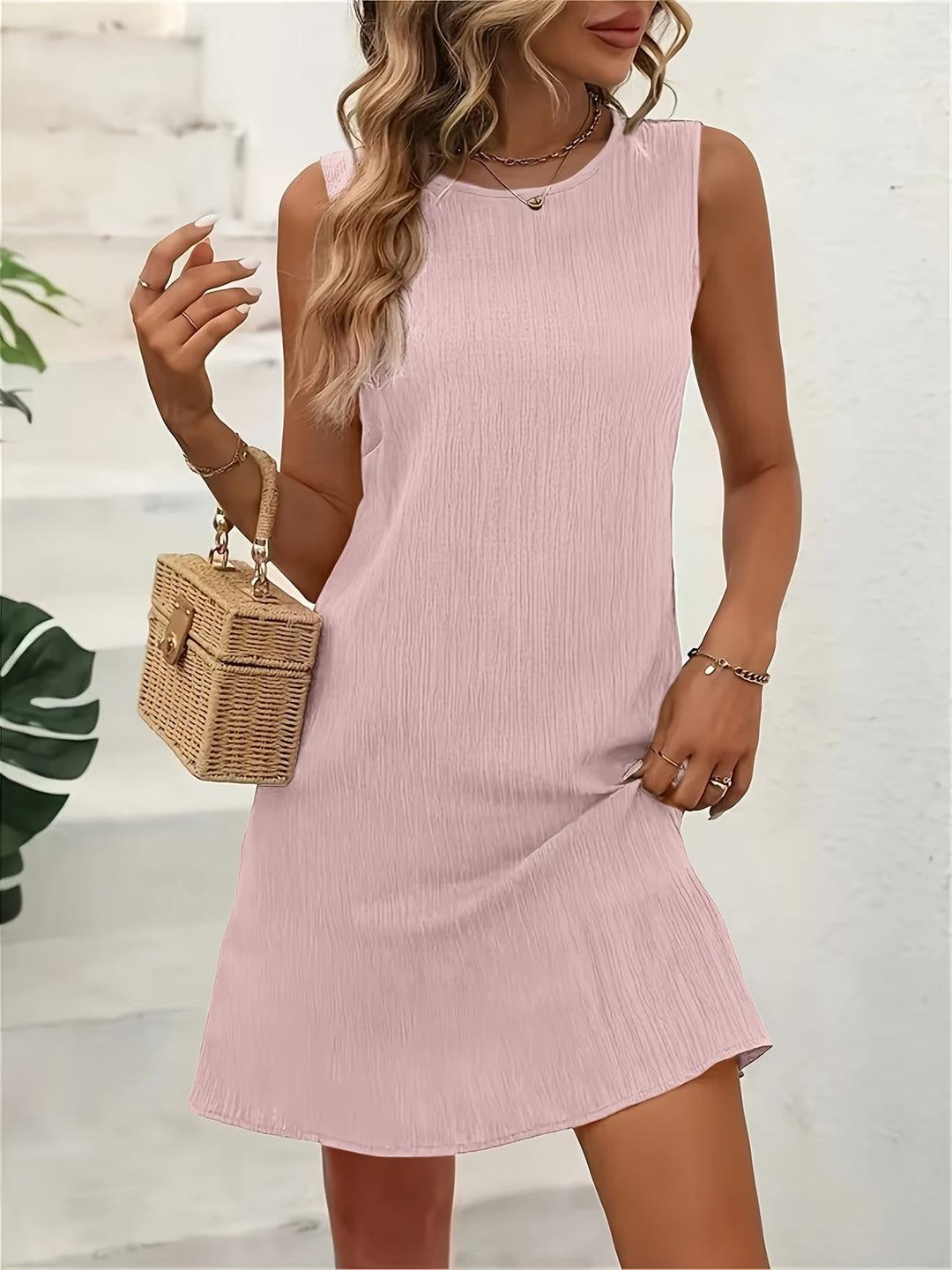 Women's casual sleeveless round neck summer dress. Comfortable flowy design, perfect for everyday wear & vacations.