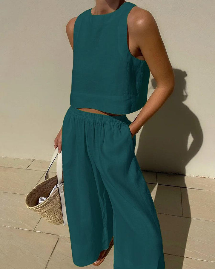 Easy care women's sleeveless capri pants set. Breathable summer wear, perfect for warm weather and casual comfort.