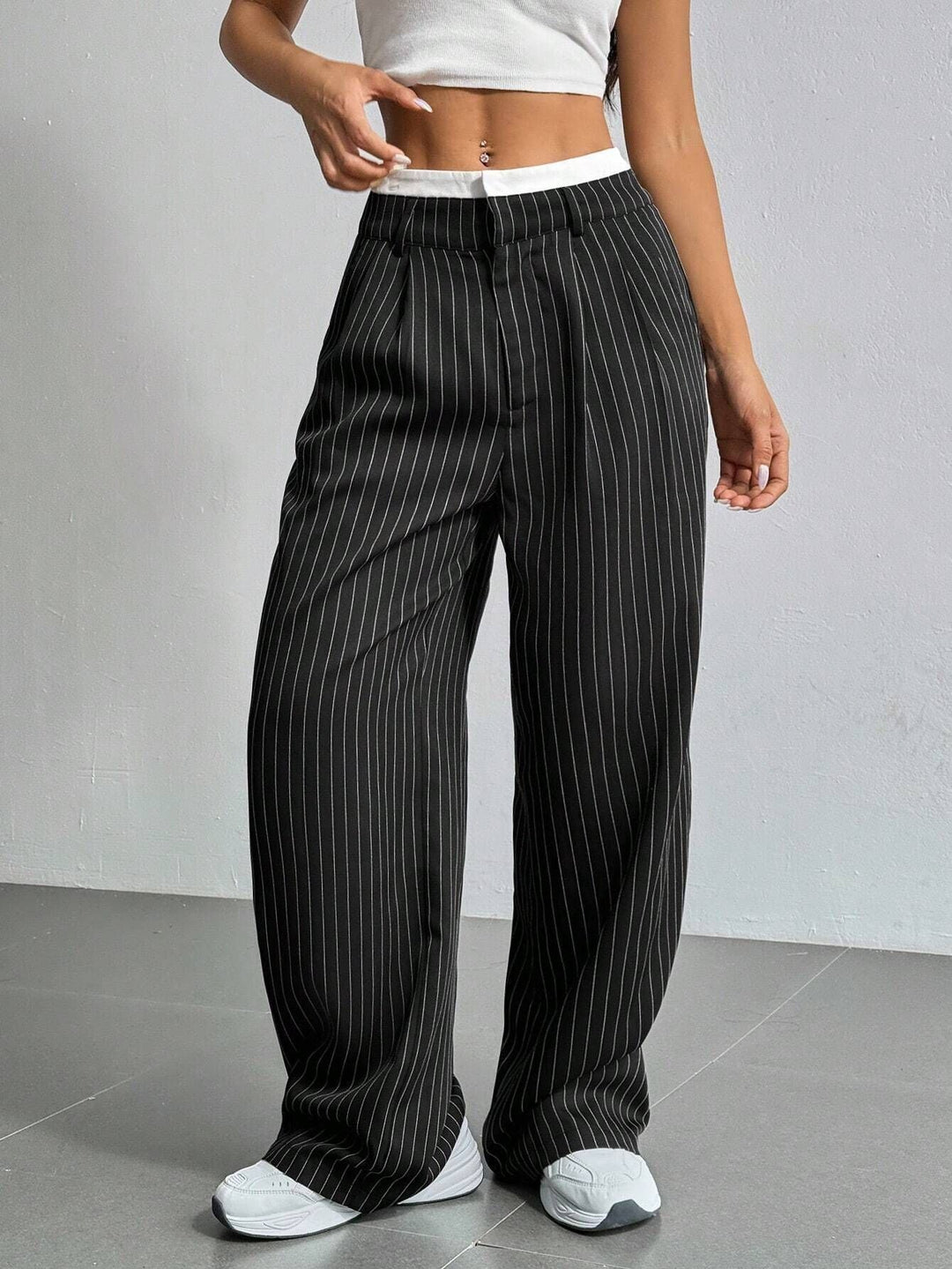 Chic women's wide leg striped trousers, a versatile modern fashion statement for daily wear.
