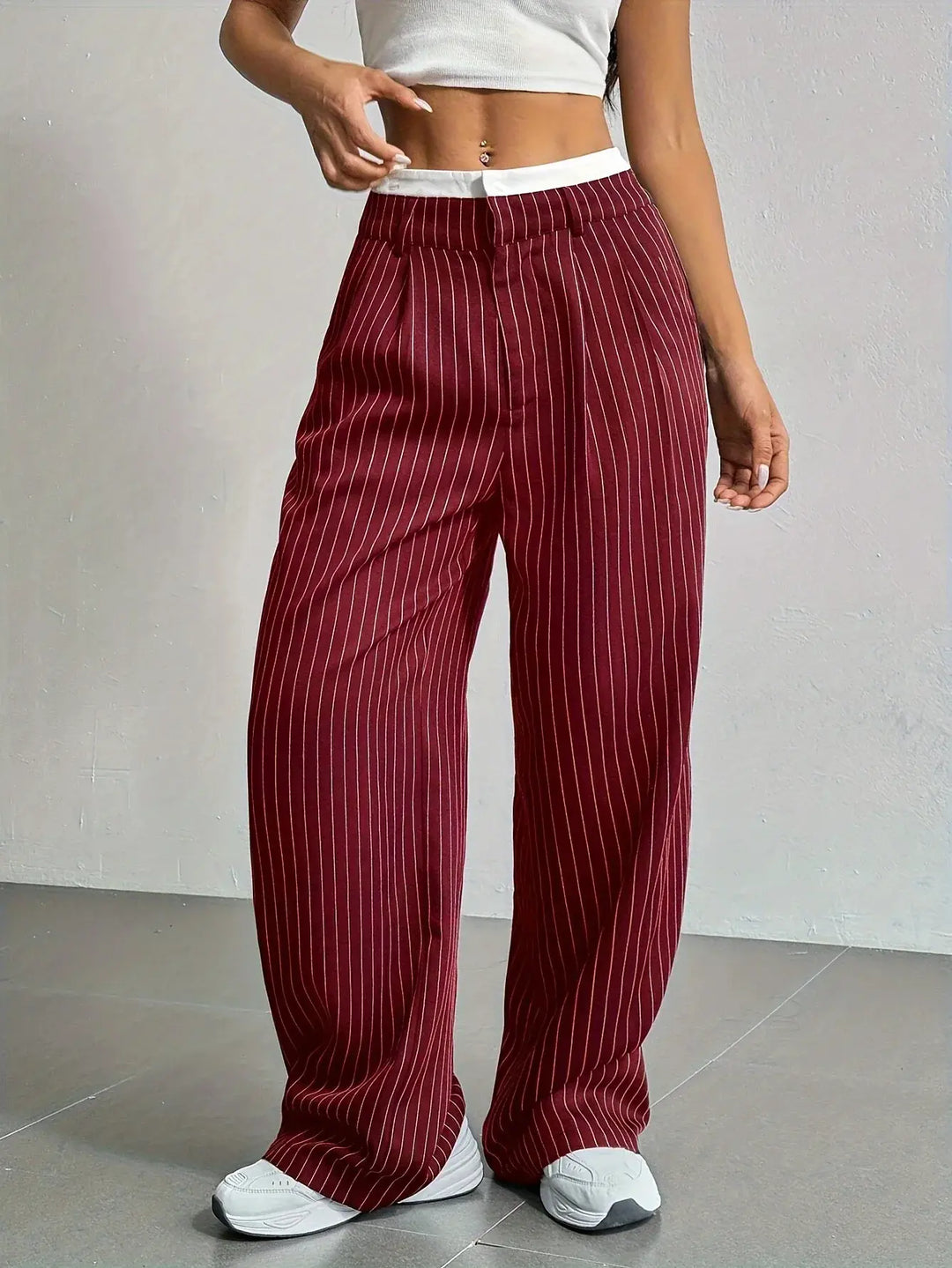 Flowy women's wide leg striped trousers, offering comfort and modern style for any occasion.