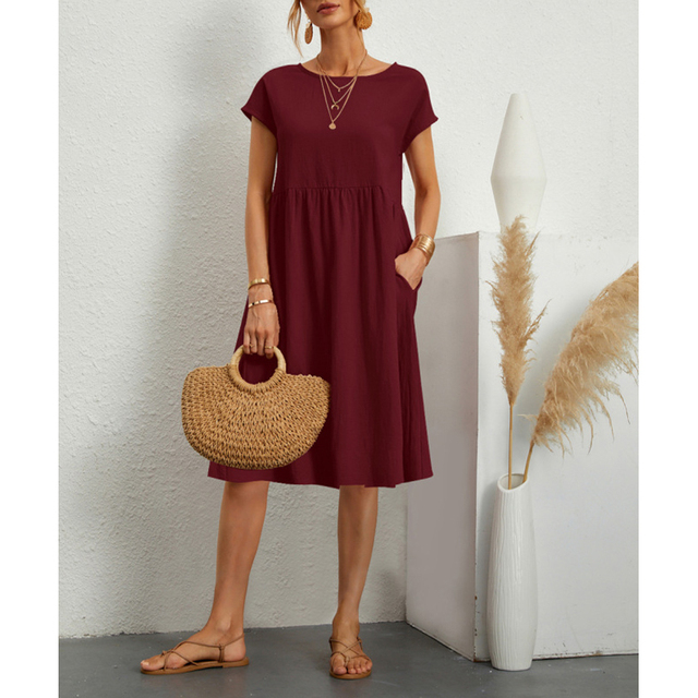 Stylish women's short sleeve midi dress for summer, featuring practical pockets & a relaxed fit.