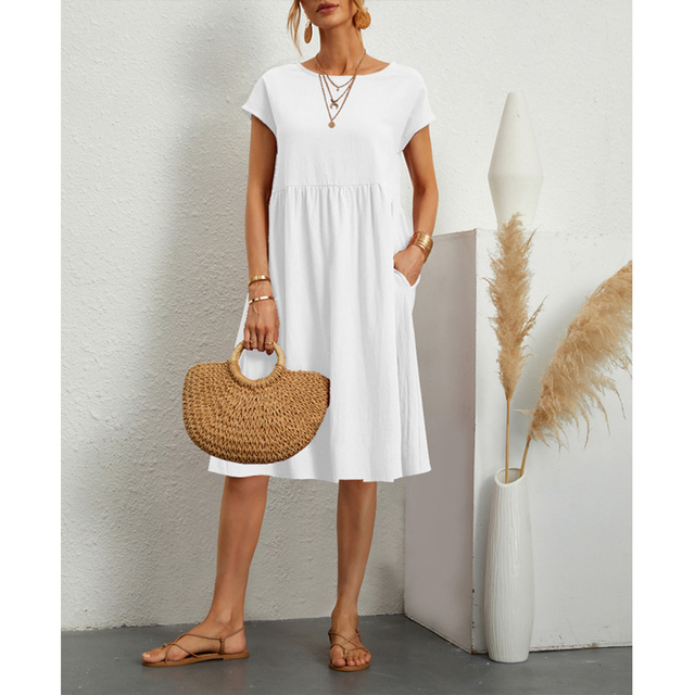 Flowy women's short sleeve midi dress, a comfortable & casual summer essential with convenient pockets.