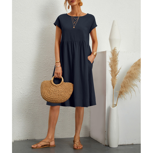 Front view of women's casual summer midi dress, showcasing a comfortable fit, short sleeves & pockets.