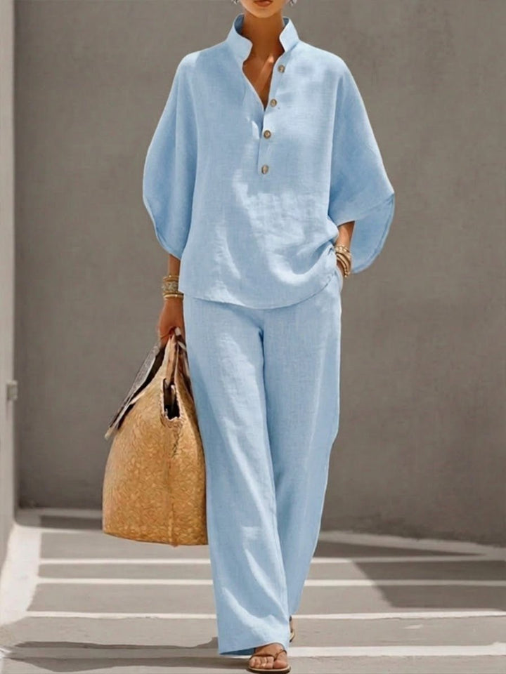 Chic women's two-piece co-ord set with a comfortable batwing top & versatile wide-leg pants for casual wear.