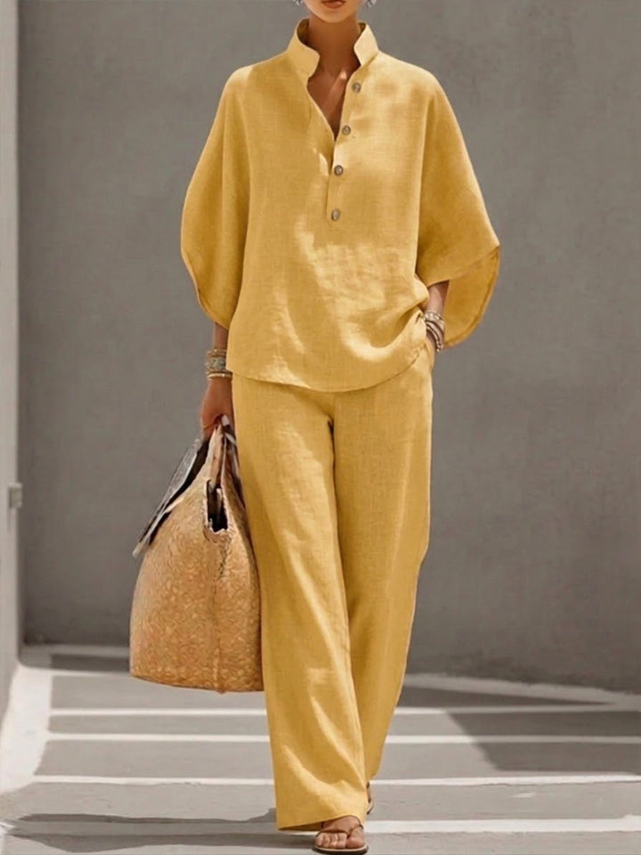 Fashionable women's two-piece co-ord set, a versatile batwing top & chic wide-leg pants for any occasion.