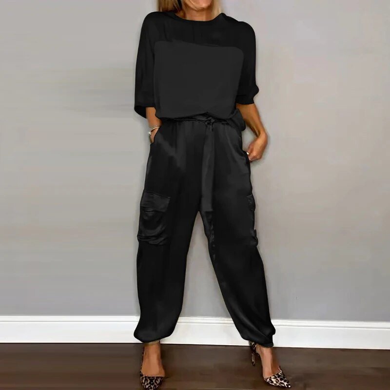 Plus size women's coordinated casual outfit featuring straight leg utility pocket trousers and a comfortable top.