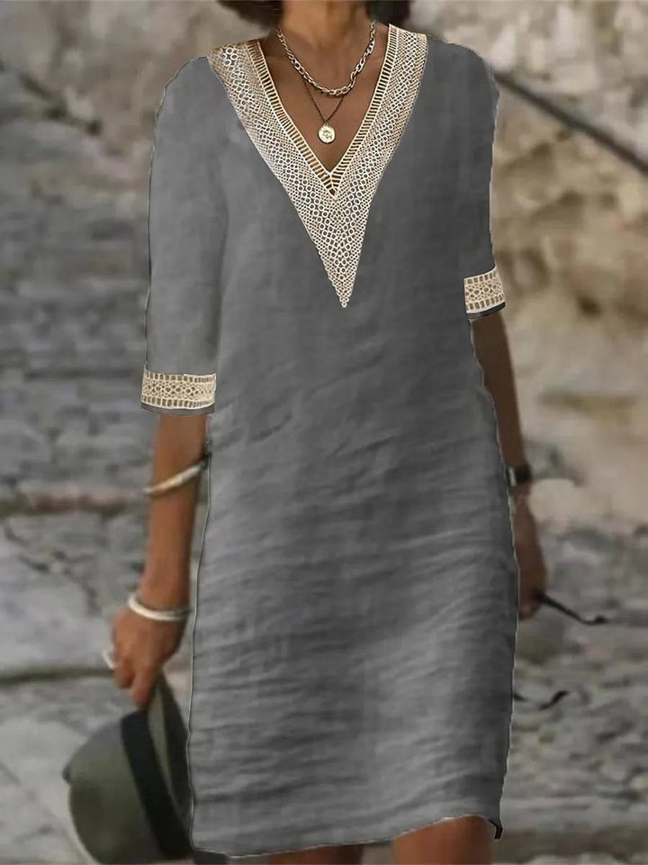 Women's casual V-neck dress with delicate lace trim, perfect for everyday comfort and versatile styling.