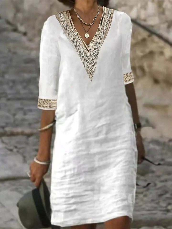 Women's comfortable V-neck dress with lace trim and 3/4 sleeves, a perfect casual knee-length outfit.