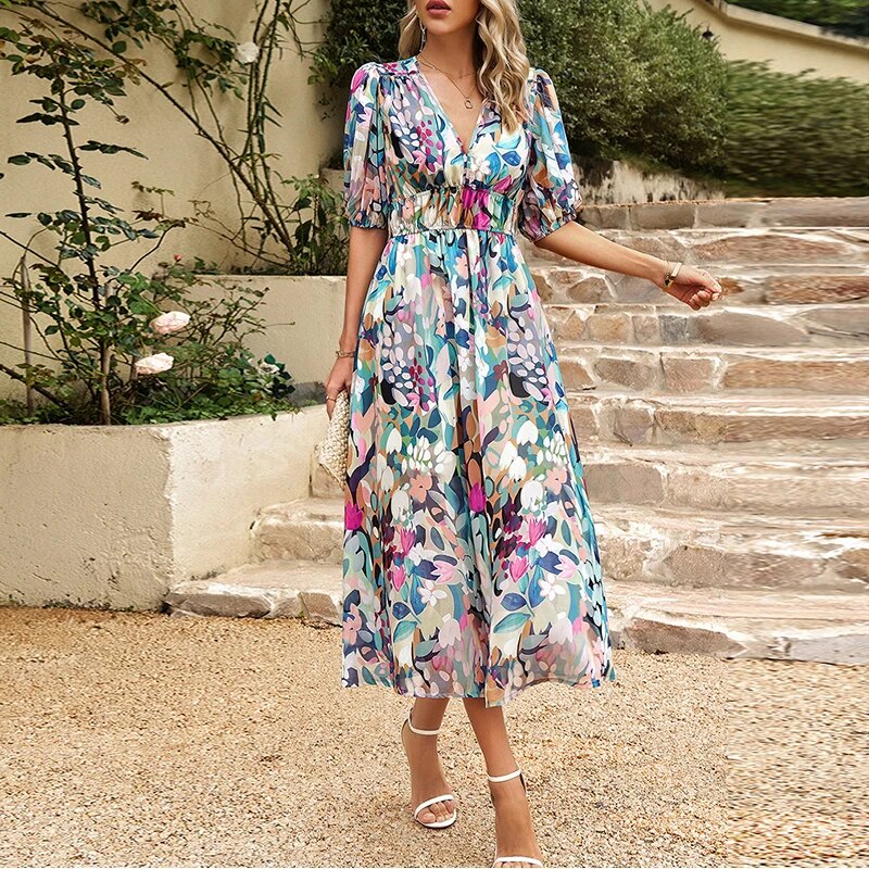 Woman posing in an elegant V-neck midi dress, showcasing a comfortable and stylish summer look.