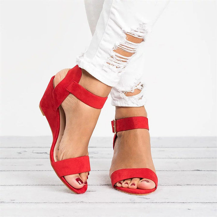Stylish open-toe wedge sandals for women, featuring an adjustable ankle strap, perfect for versatile summer wear.