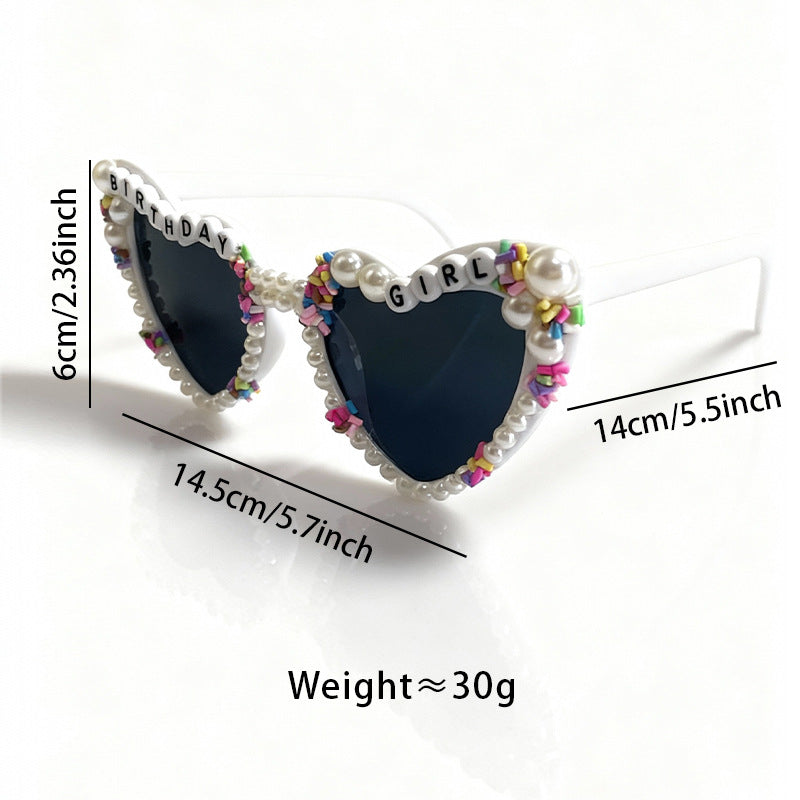 Fashionable women's cat-eye sunglasses with pearl accents, offering UV protection for birthday celebrations.