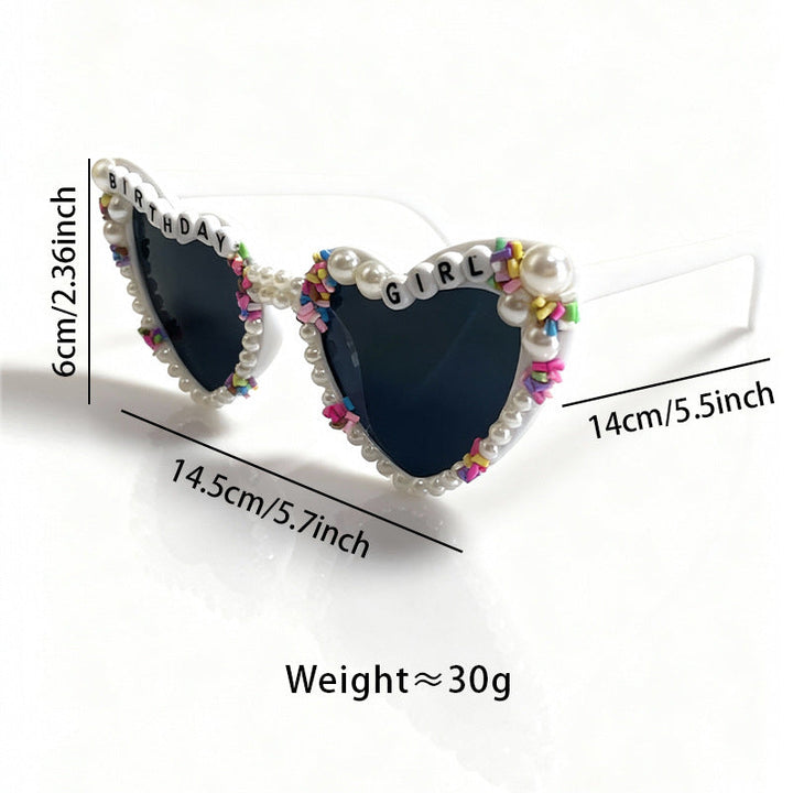Fashionable women's cat-eye sunglasses with pearl accents, offering UV protection for birthday celebrations.