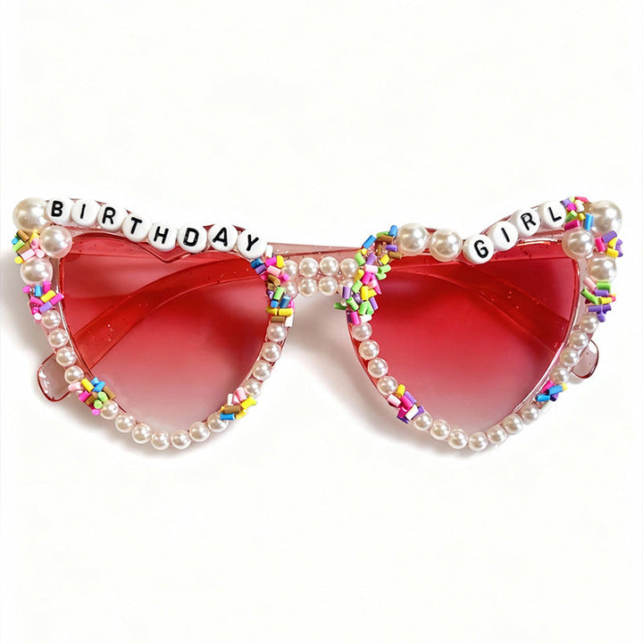Decorative women's cat-eye sunglasses with elegant pearl accents, stylish party eyewear for her birthday.