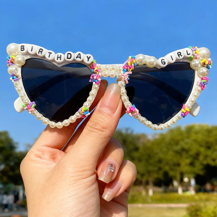 Chic women's cat-eye sunglasses featuring pearl embellishments, great for birthday parties.