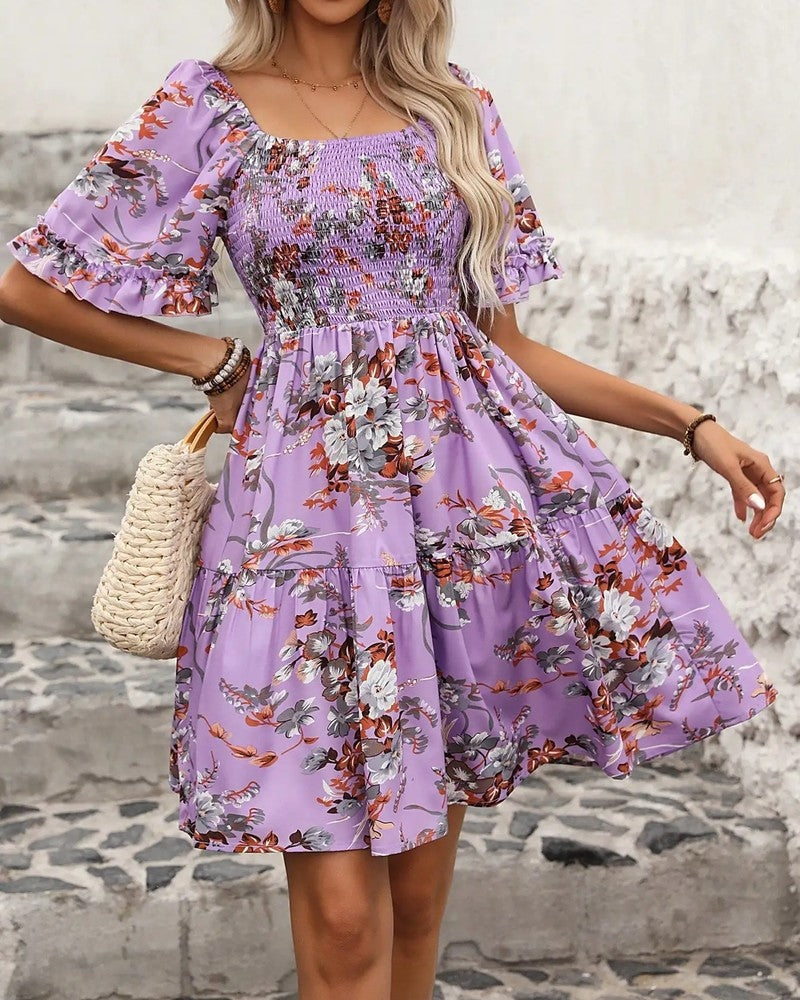 Women's charming floral smocked mini dress with puff sleeves, perfect for summer parties or casual wear.