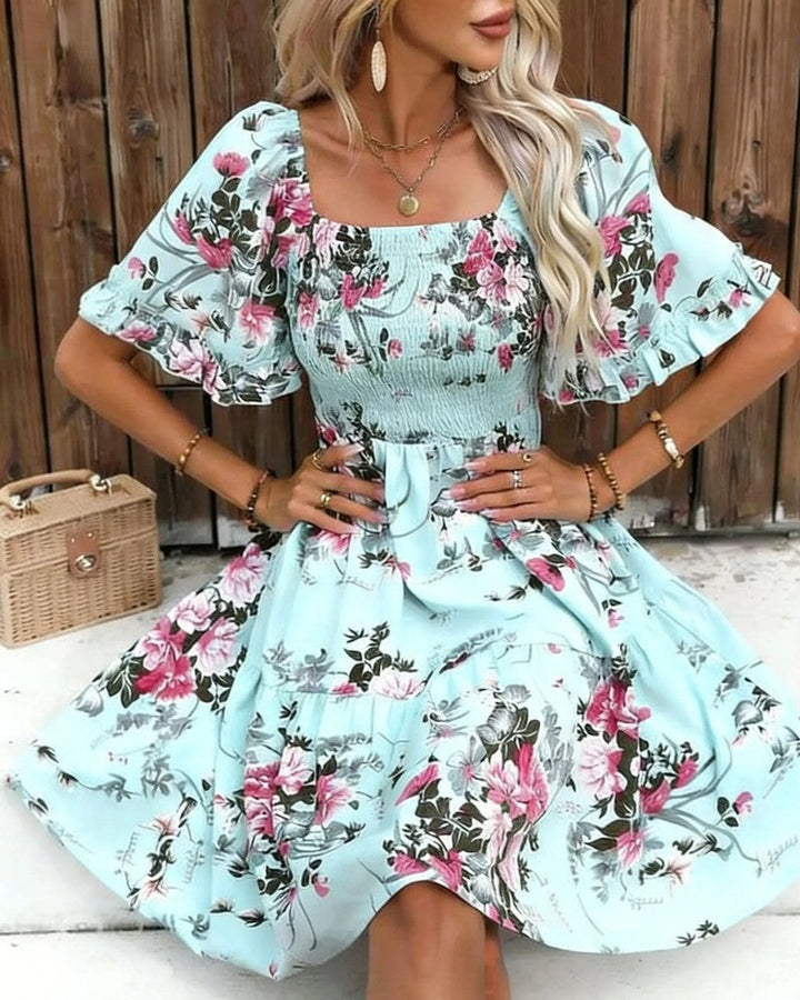 Casual yet elegant floral puff sleeve mini dress for women with smocked detail. Perfect trendy summer look.