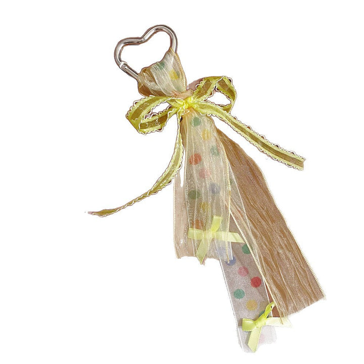 Stylish heart bag charm with a vibrant ribbon bow, a cute and durable women's accessory.