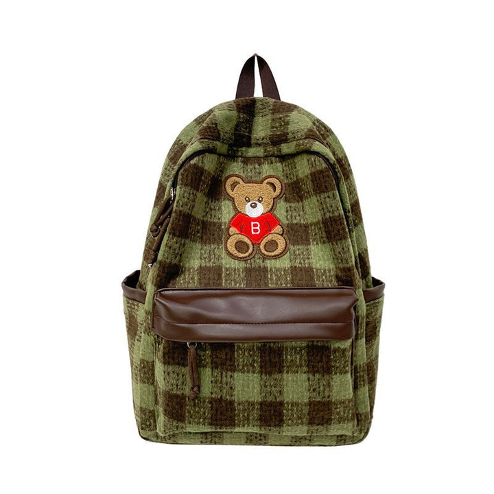 Stylish women's daypack in a classic checked pattern, adorned with a playful teddy bear appliqué detail.