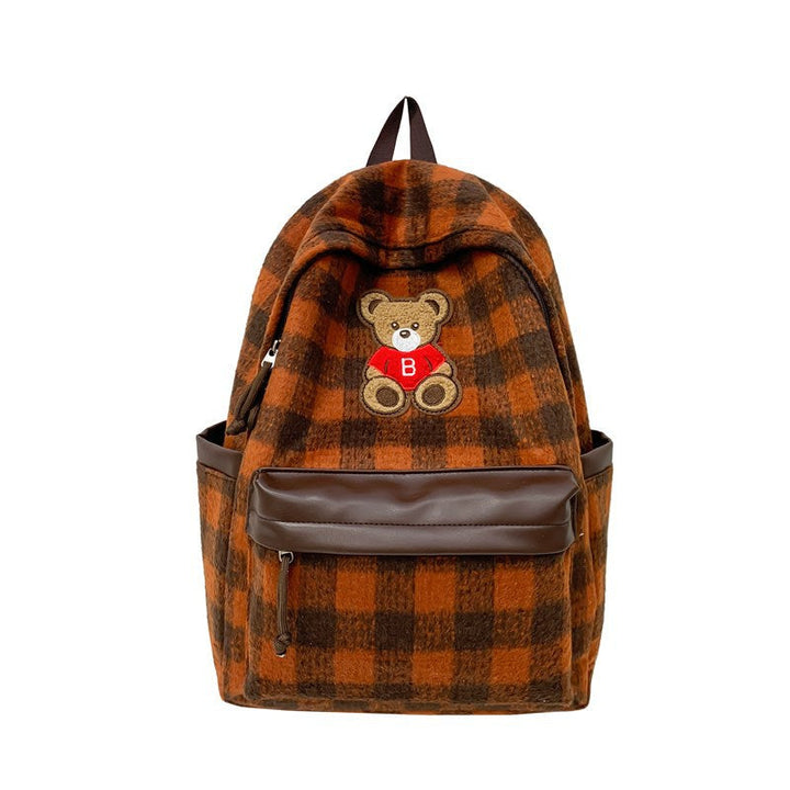 Cute women's checked backpack with a soft teddy bear appliqué, ideal for daily use and fashion-forward looks.