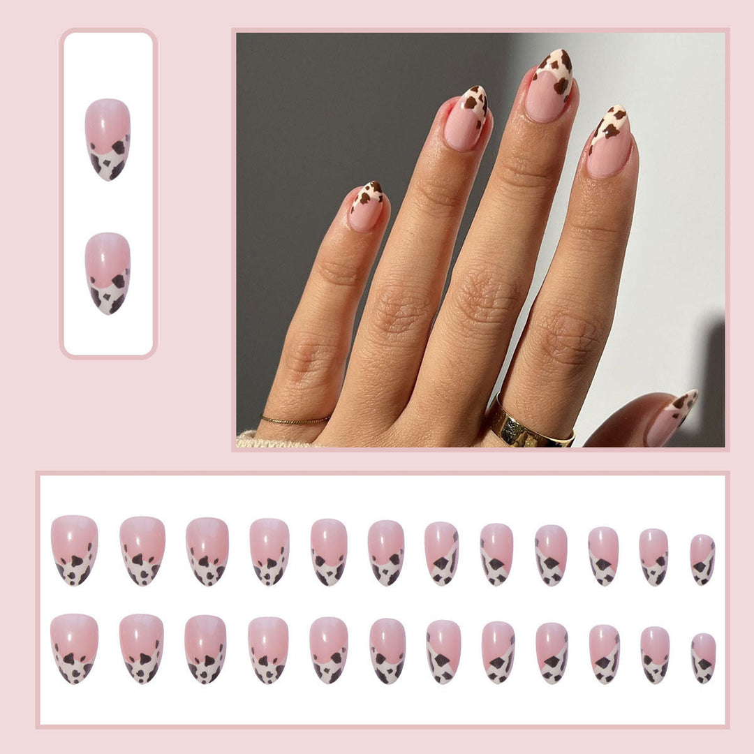 Glamorous black and white animal print press-on nails for women. Chic fake nail art set for a stylish look.