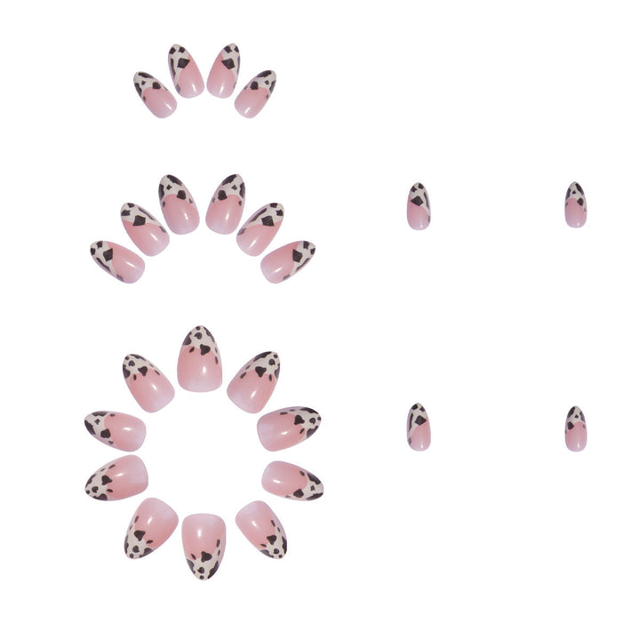 Trendy animal print nail art kit. Chic and glamorous women's press-on fake nails with stylish black designs.