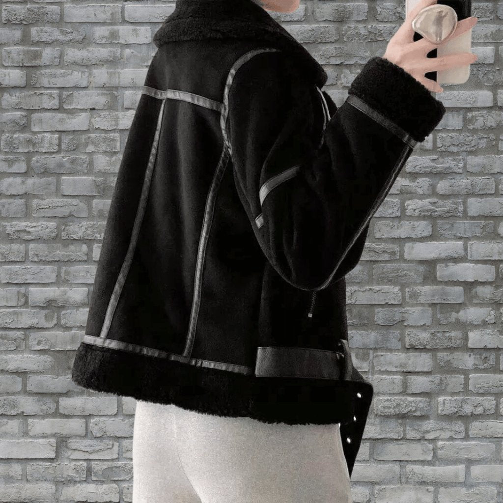 Fall fashion: Women's chic aviator zip jacket worn outdoors, perfect for crisp weather.