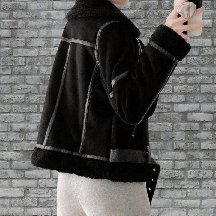 Fall fashion: Women's chic aviator zip jacket worn outdoors, perfect for crisp weather.