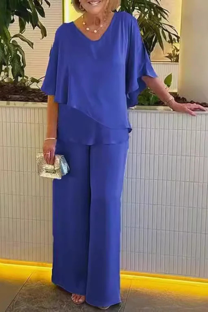 Elegant batwing sleeve top and wide leg trousers set for women. A chic and relaxed summer outfit.