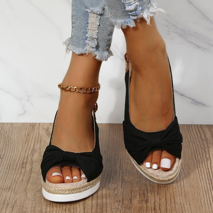 Women's chic beige wedge sandals with knot detail, open toe, and slingback for effortless summer style.
