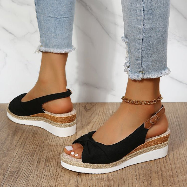 Comfortable women's platform wedge sandals with elegant knot detail, perfect for casual summer outings.