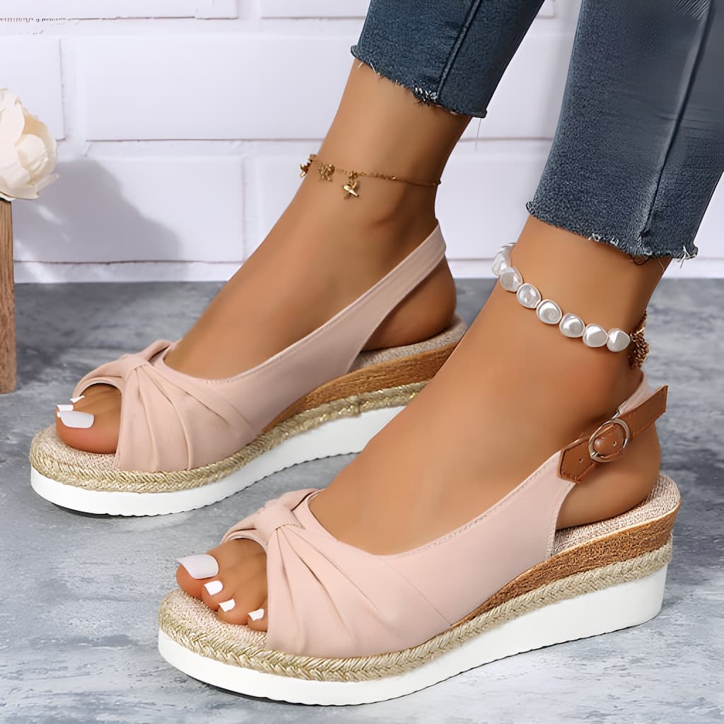 Elegant beige women's wedge sandals with chic knot design & platform sole, ideal comfortable casual summer footwear.