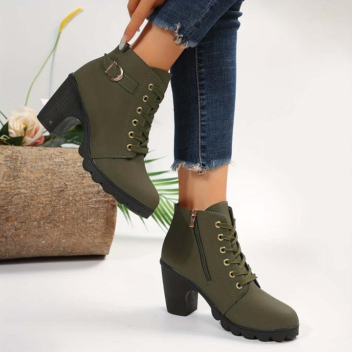 Women's chic black block heel ankle boots with stylish buckle. Versatile fashion footwear.