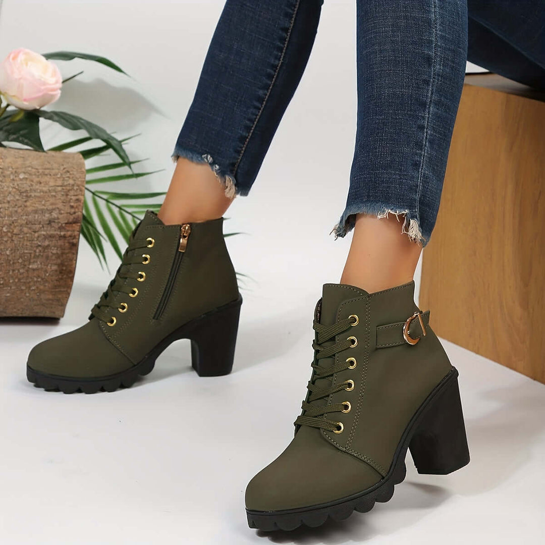 Comfortable women's block heel ankle boots, chic buckle detail, non-slip sole. Easy zip closure.