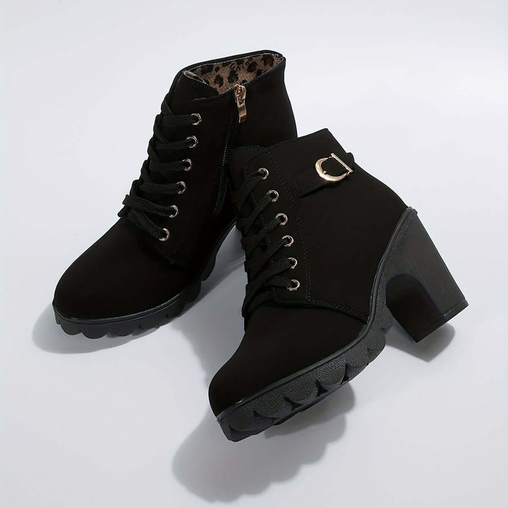 Chic red women's block heel ankle boots with elegant buckle. Stylish and comfortable footwear for autumn.