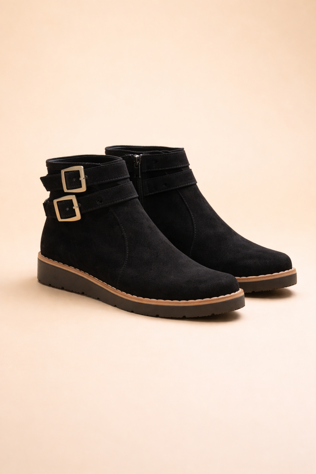 Women's chic black structured ankle boots with buckle detail, perfect for versatile fall and winter fashion.