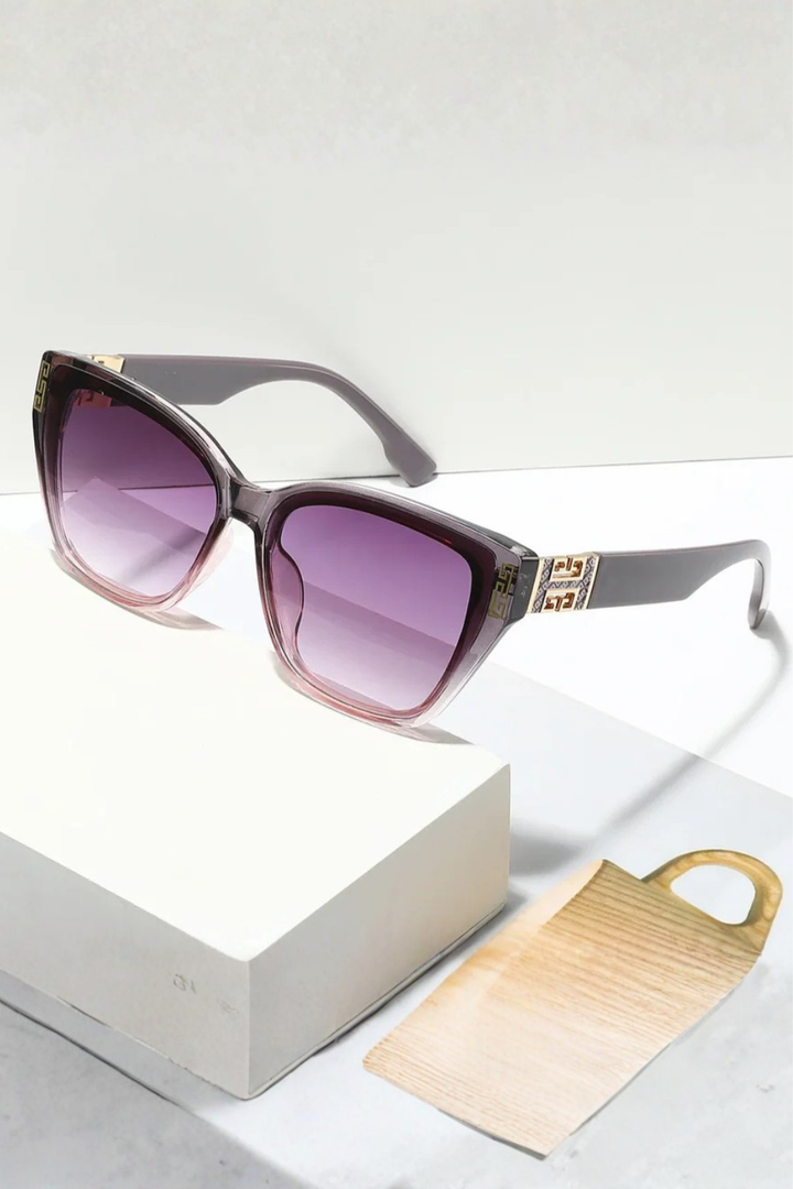 Distinctive cat eye women's sunglasses, featuring bold frames and elegant gold embellishments.