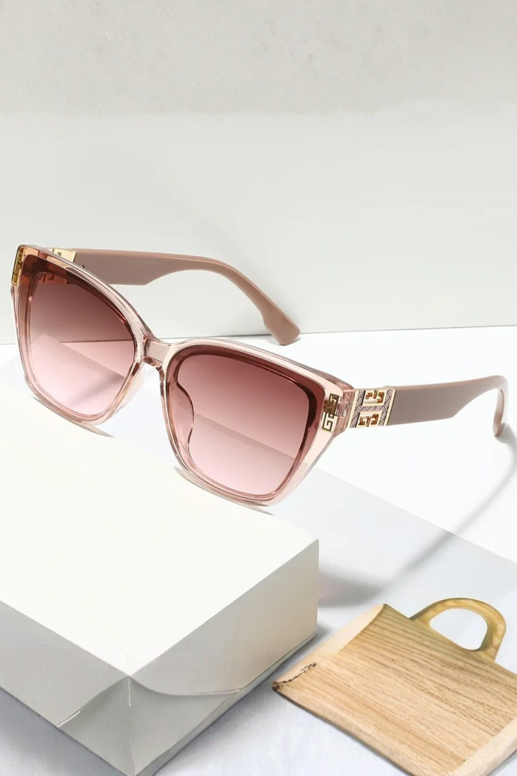 Women's fashionable cat eye sunglasses, a must-have accessory with eye-catching gold detail.