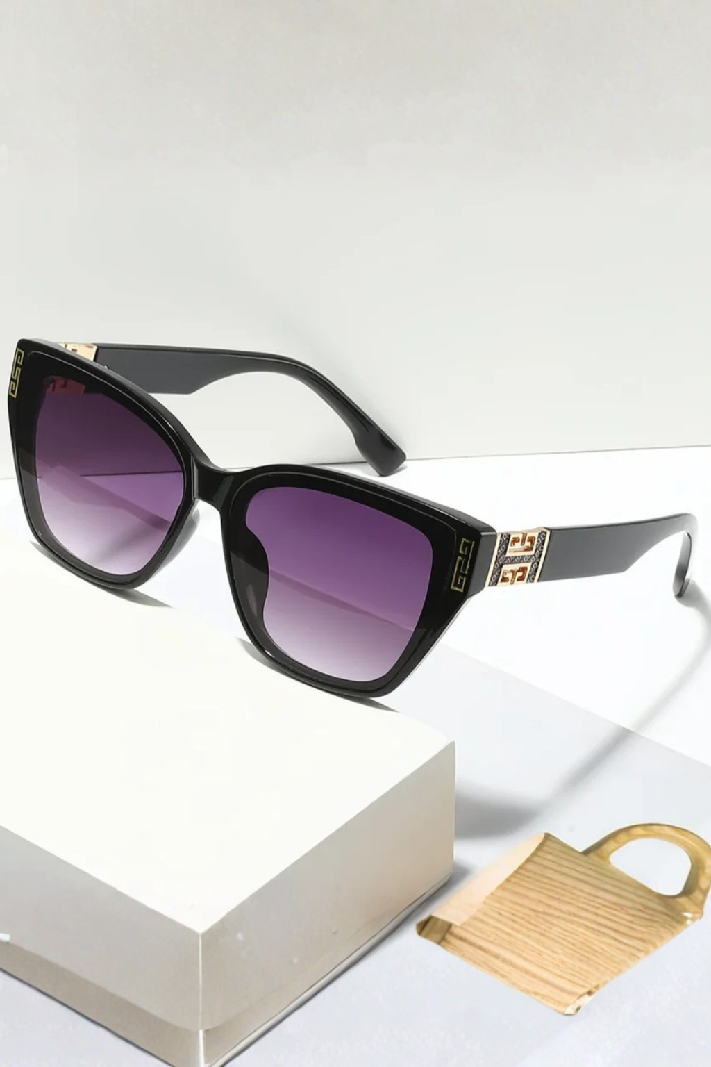 Essential women's fashion accessory: cat eye sunglasses with sophisticated gold accents.