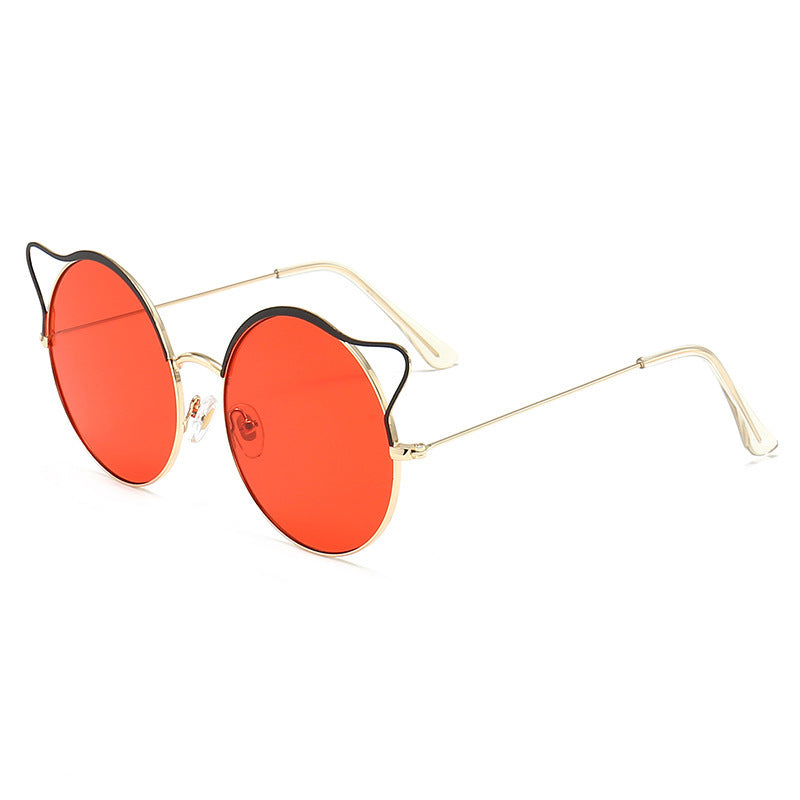 Modern women's cat-eye sunglasses, featuring mirrored lenses for UV protection & lightweight design.