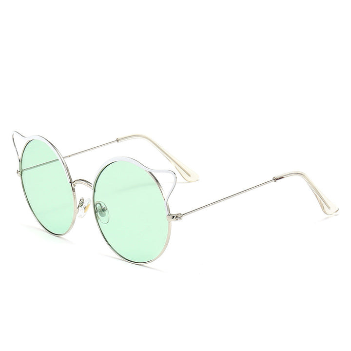 Close-up of women's chic cat-eye sunglasses, showcasing reflective mirrored lenses & stylish frame.